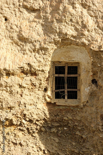 Obraz na plátně old window in the wall of abandoned troglodyte cave hose in Guadix, Spain