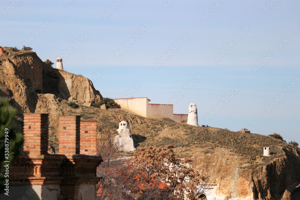 View to the troglodyte dwellings carved in tuff rocks of Guadix, Spain