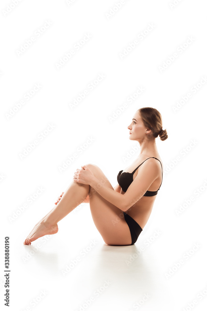 Beautiful woman in underwear isolated on white background. Beauty, cosmetics, spa, depilation, treatment and fitness concept. Fit and sportive, sensual body with well-kept skin, doing exersices.