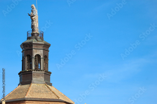 Statue on the top of Guadix cathedral bell tower  Spain