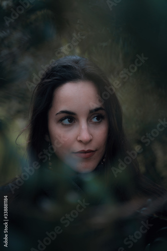 Portrait of young woman in the woods