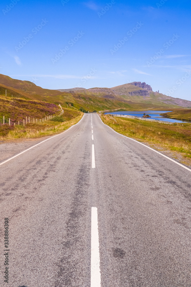 Scottish landscapes: road at Isle of Skye with the Old Man of Storr in the distance