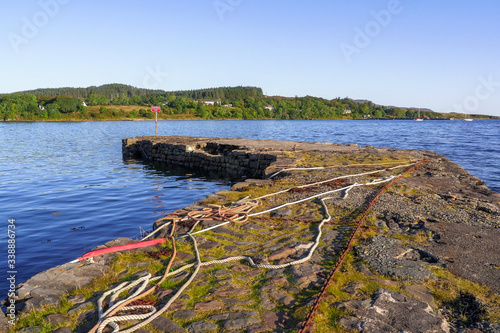 Chains and ropes on a stone dock at Broadford, Isle of Skye, Scotland / UK photo