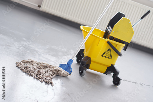 Tablou pe pânză Mop and bucket, janitorial service.