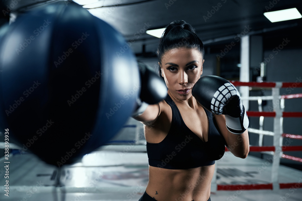 Woman fighting in boxing gloves.