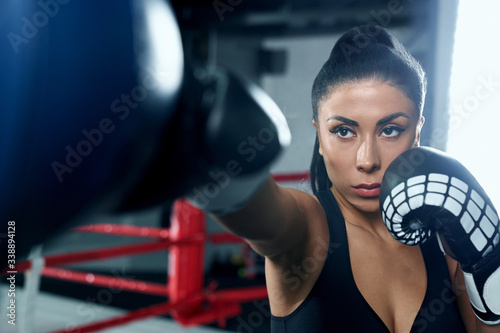 Woman fighting in boxing gloves.