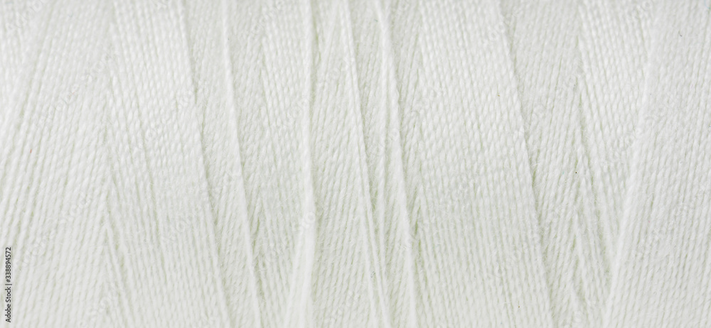 Obraz premium Closeup of thread wound on spool.
