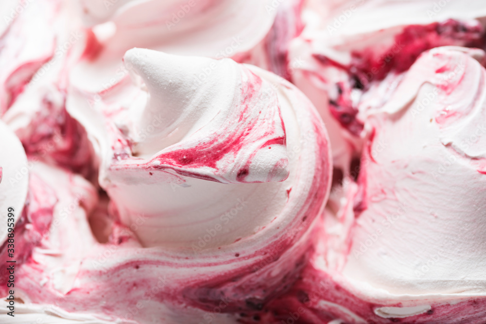Cherry flavour gelato - full frame detail. Close up of a white surface texture of Cherry Ice cream covered with red stripes Cherry flavour gelato - full frame detail. Close up of a white surface texture of Cherry Ice cream covered with red stripes