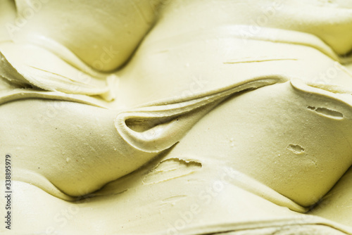 Pistachio flavour gelato - full frame detail. Close up of a creamy green surface texture of Pistachio Ice cream