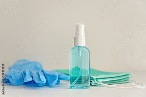 Medical masks, gloves and hand sanitizer bottle, anti-infective hygienic and health protection concept, Coronavirus Covid-19 photo