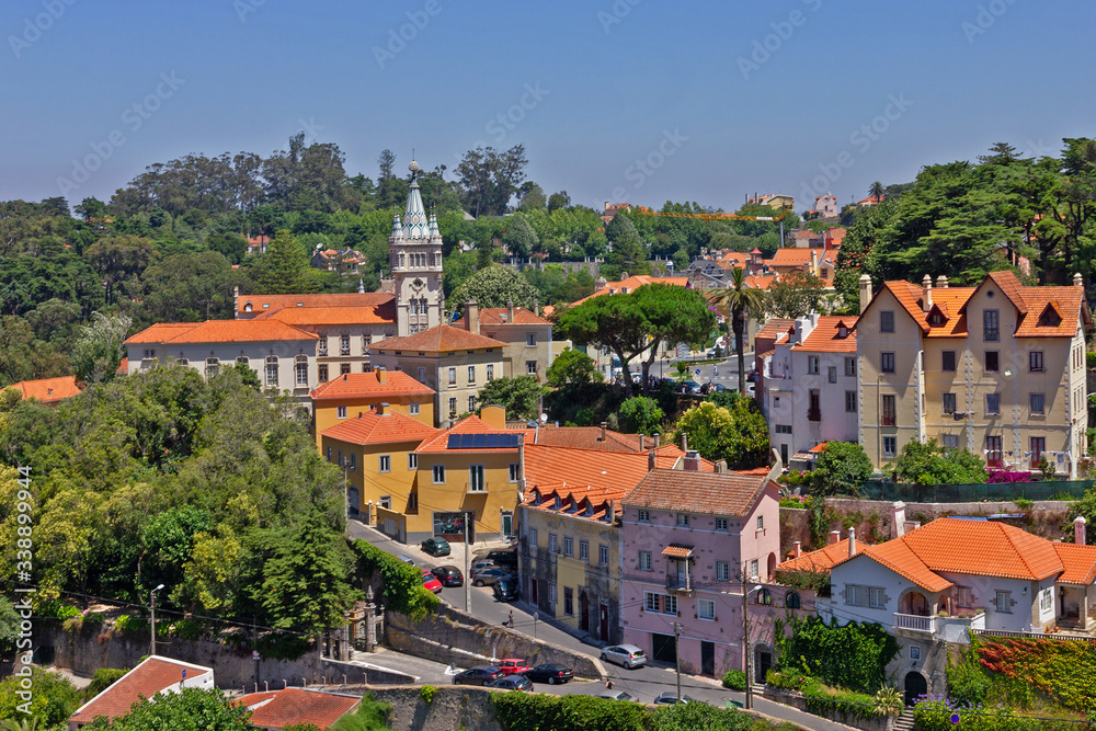 Sintra town houses with red roofs green street landscape, Portugal