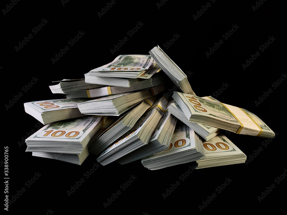 A lot of bundles of american dollars, on a black background. A bunch of one  hundred dollar bills, packed in packs of ten thousand. Concept: Million,  Wealth, Financial Stock Photo | Adobe