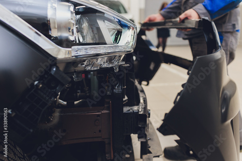 auto mechanic repair car body bumper replacement.