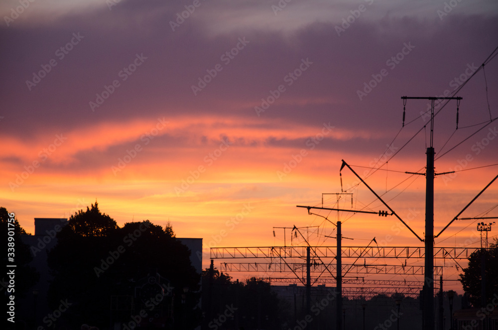 power lines at sunset at the train station