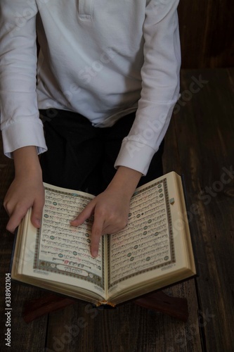 Photography .little boy learning quran