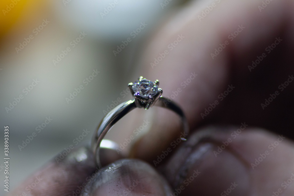 Obraz premium white gold precious metal ring jewelry making process with transparent white stone