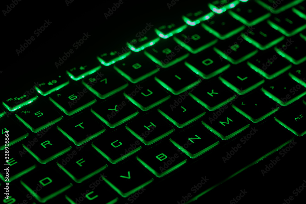 computer keyboard with green key