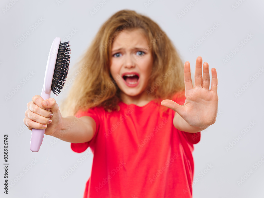 Cheerful girl with comb in hands emotions lifestyle discontent Cheerful girl with comb in hands emotions lifestyle discontent