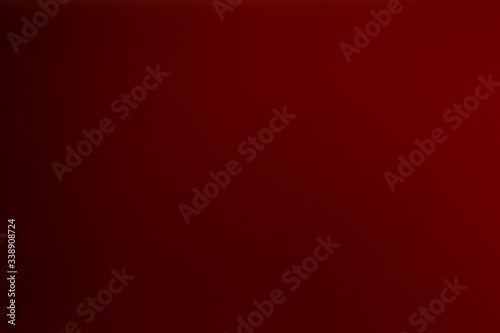 Warm burgundy background, dark red color background texture photo