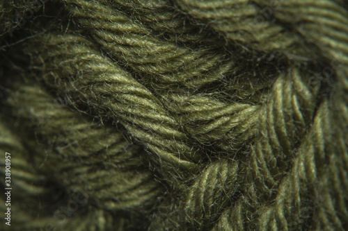 Billede på lærred Close-up macro shots a green wool thread on the wool thread ball