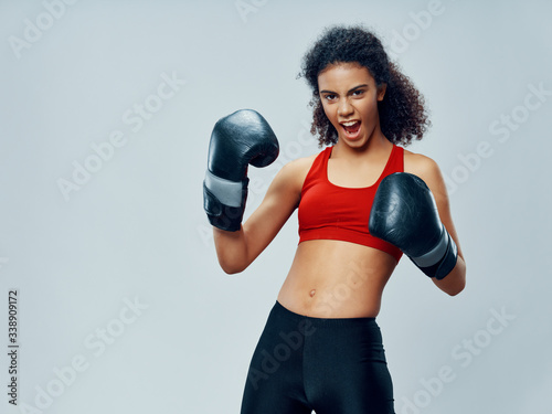 Athletic woman exercise training boxing gloves motivation © SHOTPRIME STUDIO