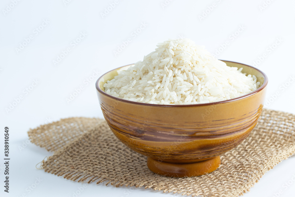 Close up a bowl of uncooked long grain white rice