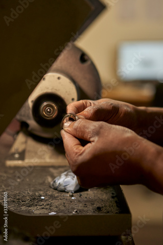 Man polishing a diamond ring