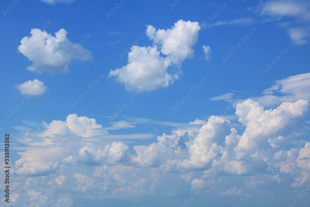 Background of blue sky with clouds. Blue, white pastel paradise, soft focus lenses, glare of sunlight. Abstract blurred blue gradient of a peaceful nature. View from the windows of a beautiful summer Background of blue sky with clouds. Blue, white pastel paradise, soft focus lenses, glare of sunlight. Abstract blurred blue gradient of a peaceful nature. View from the windows of a beautiful summer