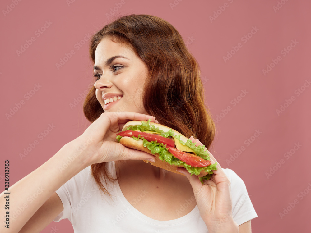 Beautiful charm woman hamburger fast food meal close-up Beautiful charm woman hamburger fast food meal close-up