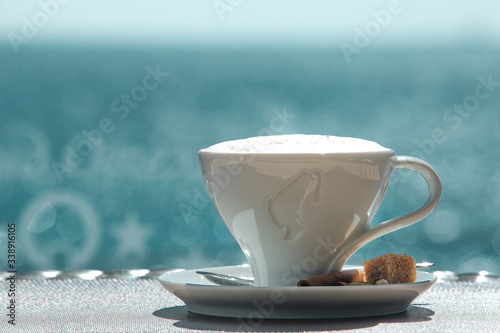Bilde på lerret A cup of coffee with blue sea views