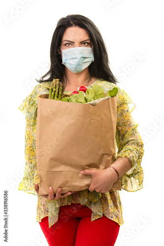 Woman with protective mask and shopping bag photo