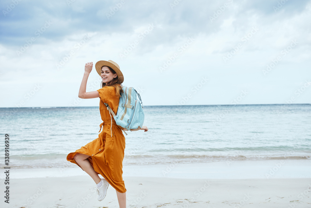 Woman hiker walk backpack beach horizon island Woman hiker walk backpack beach horizon island