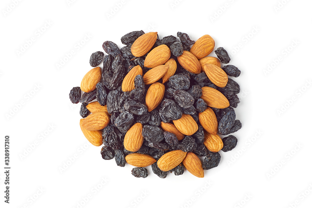 Heap of almonds and black raisins on white Heap of almonds and black raisins on white