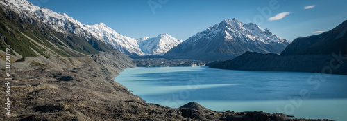 Panoramic view on glacial lake, glacier and mountain shot on sunny morning in Aoraki / Mt Cook National Park, New Zealand