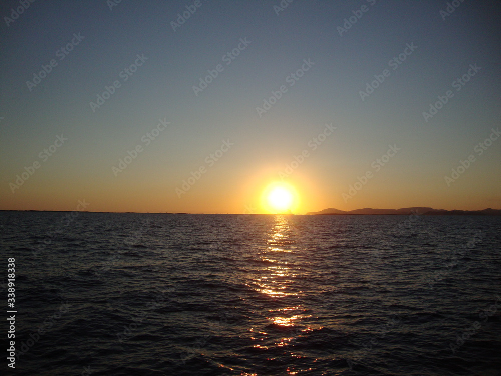 Sunset over Ibiza on a sunset cruise