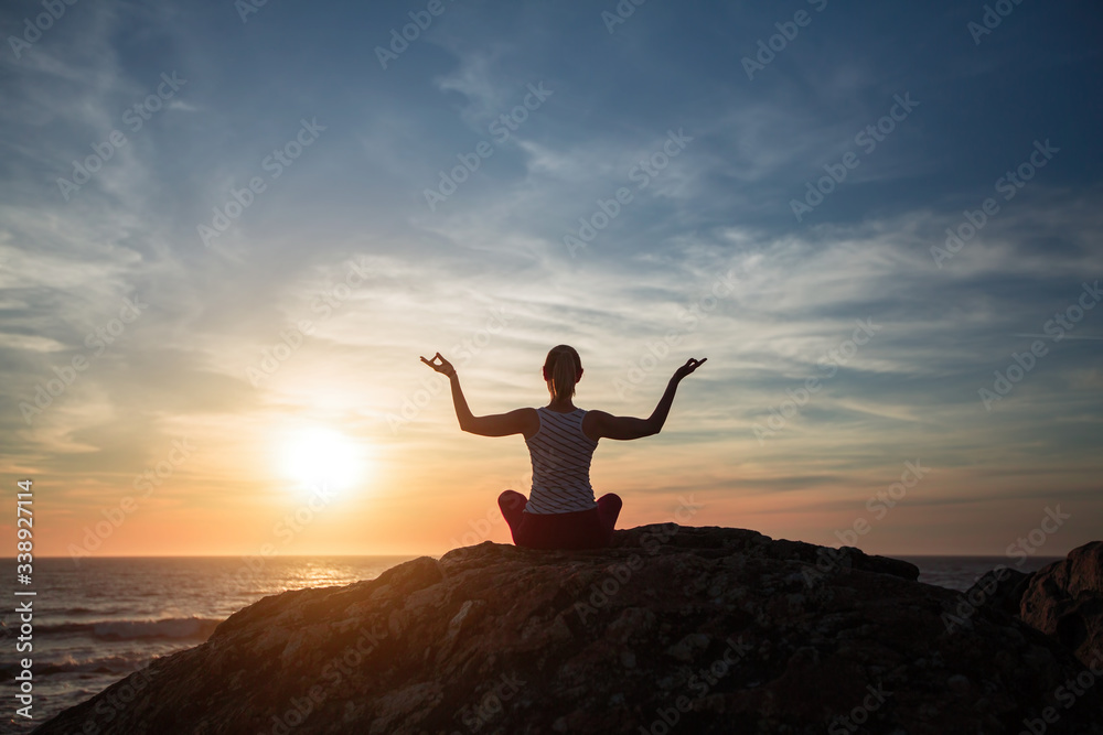 Silhouette of yoga woman practicing of the ocean, morning exercises.