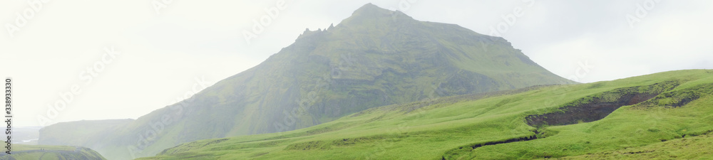 Naklejka premium Green mountains and fields of Iceland
