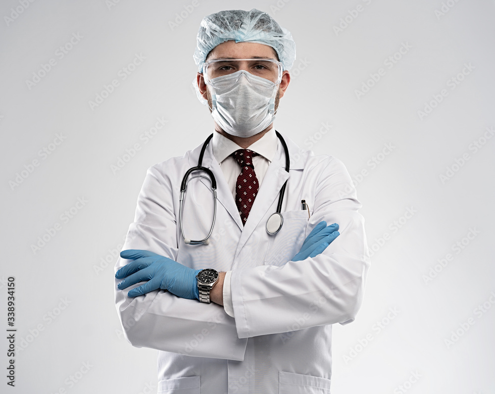 Coronavirus. Male doctor man in white medical gown sterile face mask gloves isolated. Coronavirus. Male doctor man in white medical gown sterile face mask gloves isolated.