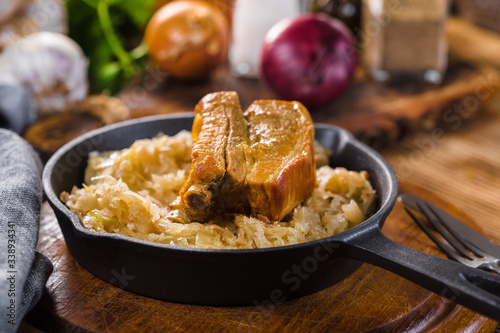 Traditional spare ribs baked in sauerkraut.