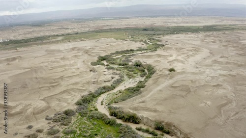 Aerial footage over Flood flowing into the Jordan River in Winter, Southern Jordan Valley, Israel
-Drone View
 photo