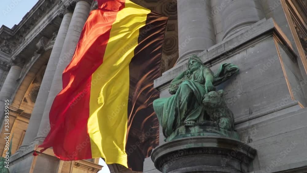 Belgium flag against tricolour stripes waving on wind from Arcade du Cinquantenaire 1920X1080 HD footage (1080p 100fps FullHD video)