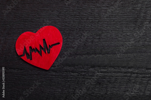 Heart against wooden background. World Health Day Concept