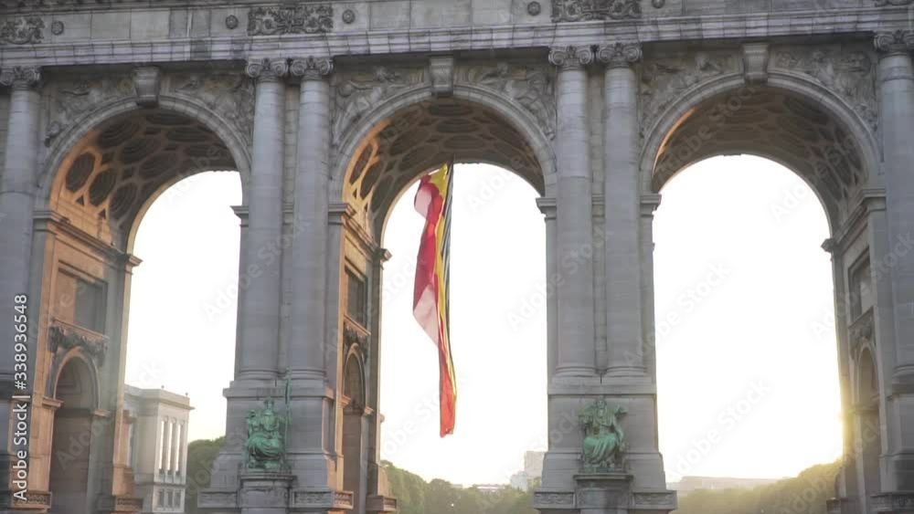 Belgium flag against tricolour stripes waving on wind from Arcade du Cinquantenaire 1920X1080 HD footage (1080p 100fps FullHD video) Belgium flag against tricolour stripes waving on wind from Arcade du Cinquantenaire 1920X1080 HD footage (1080p 100fps FullHD video)