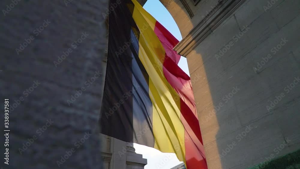 Belgium flag against tricolour stripes waving on wind from Arcade du Cinquantenaire 1920X1080 HD footage (1080p 100fps FullHD video)