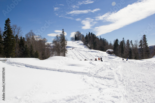 Beautiful mountains covered with snow. Sunny day and blue sky on a frosty day