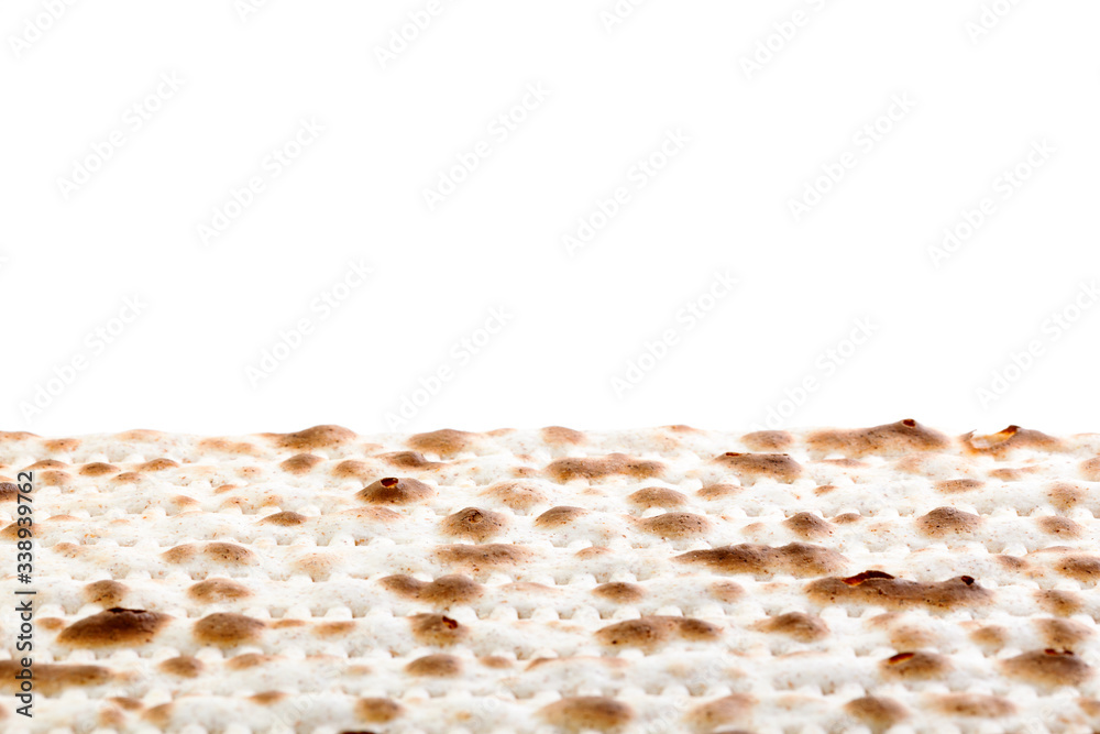 Matzah. Jewish traditional Passover bread. Pesach celebration symbol. Isolated on white. With some free space for your text or sign . Close-up.