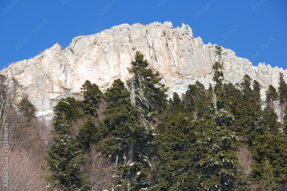 Beautiful mountains covered with snow. Sunny day and blue sky on a frosty day Beautiful mountains covered with snow. Sunny day and blue sky on a frosty day