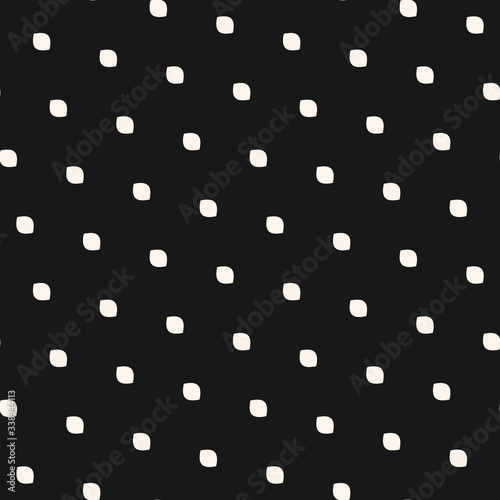 Polka dot seamless pattern. Simple minimalist black and white background. Vector monochrome subtle texture with small diagonal spots, dots, ovate shapes. Abstract minimal design for decor, covers, web