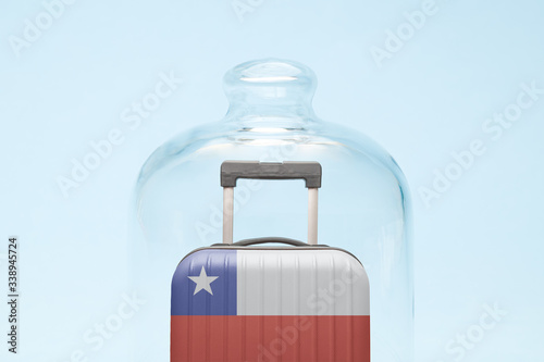 Luggage in isolation under glass cover covid-19 Chilean tourism abstract.