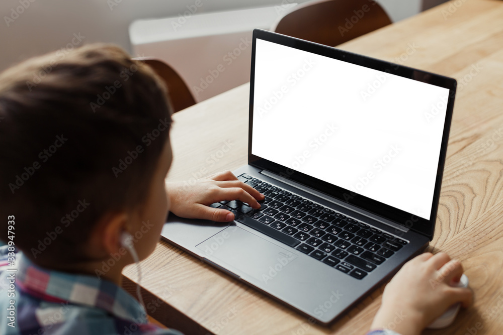 boy child sitting at a laptop, learning remotely, online classes, mock up boy child sitting at a laptop, learning remotely, online classes, mock up